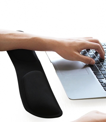 wrist rest black next to laptop